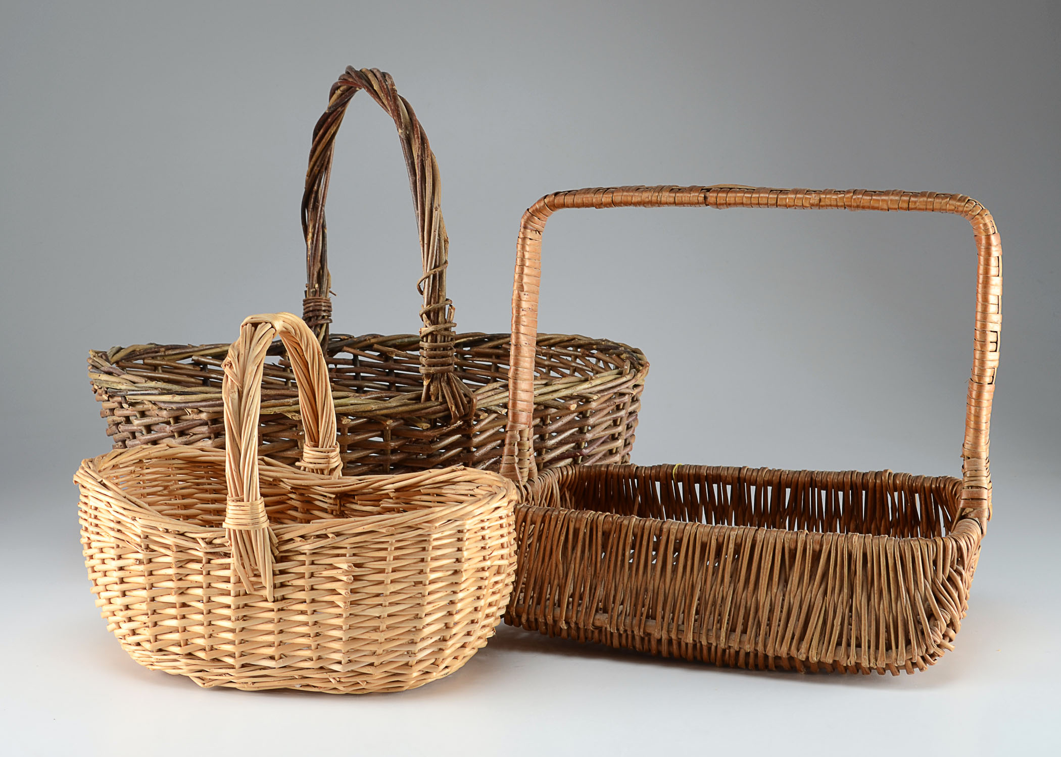 A trio of hand held baskets EBTH