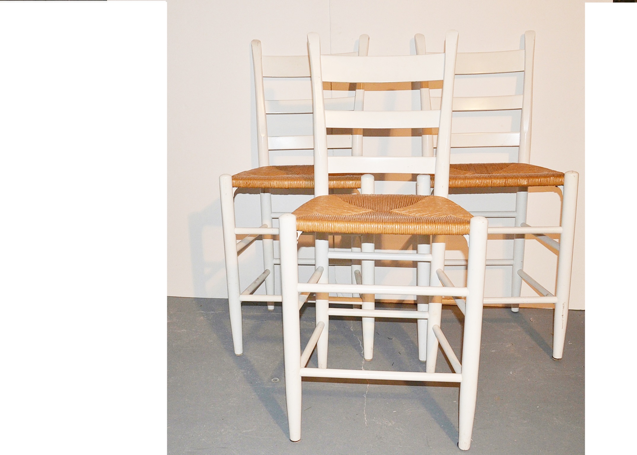 Set of three ladder back bar stools with rush seats. EBTH