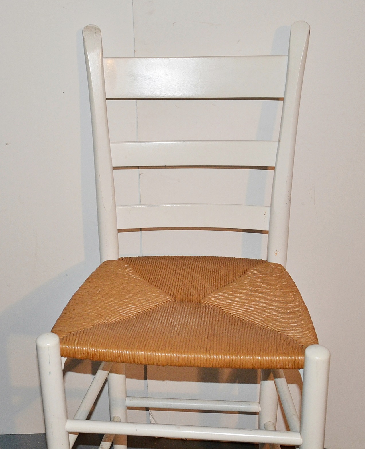 Set of three ladder back bar stools with rush seats. EBTH