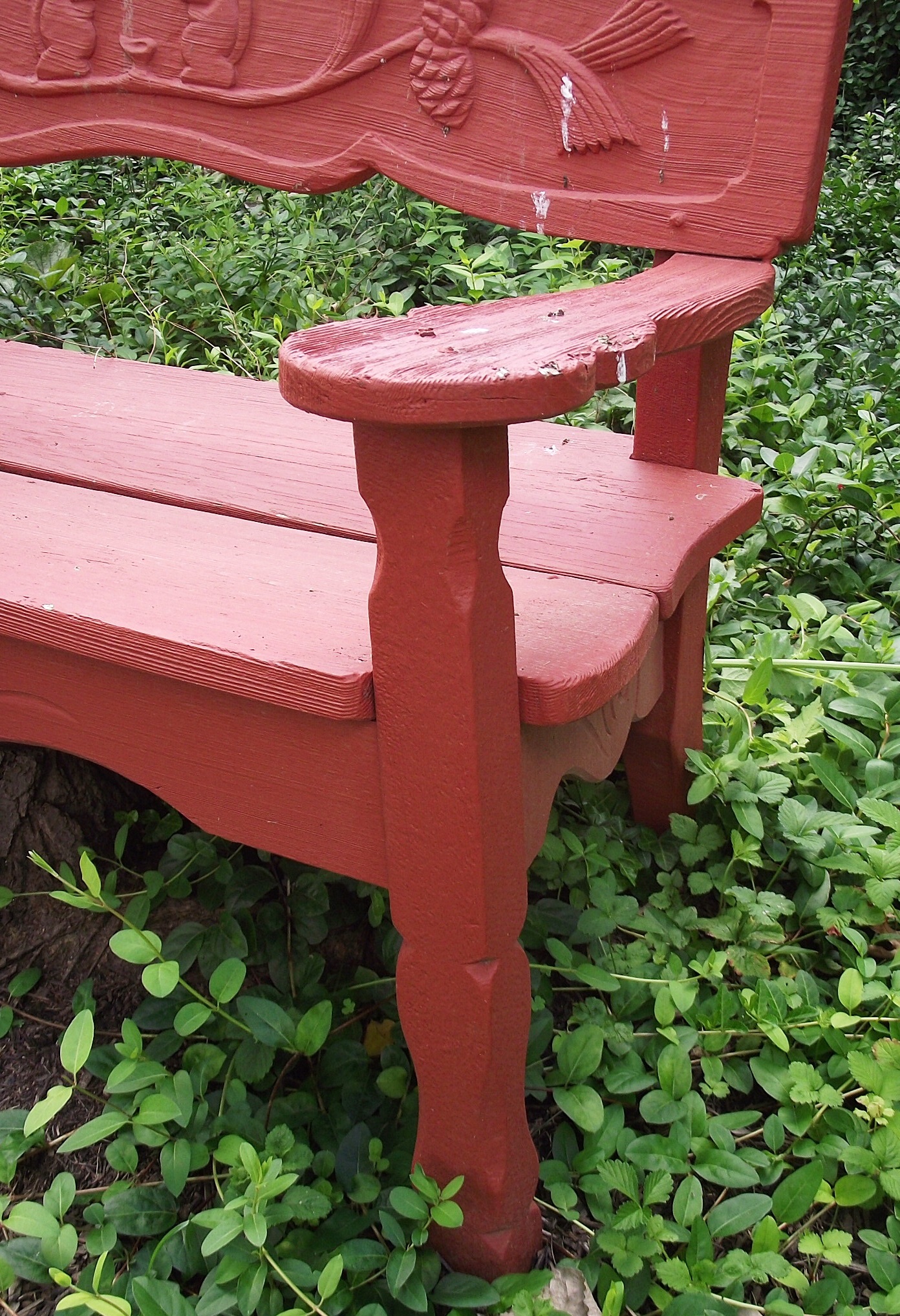 Vintage wooden garden bench with carved squirrel motif. EBTH