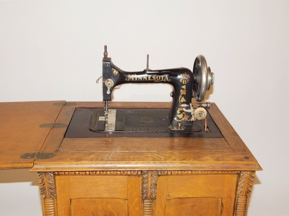 An Antique Minnesota Model B Treadle Sewing Machine In A Tiger Oak ...