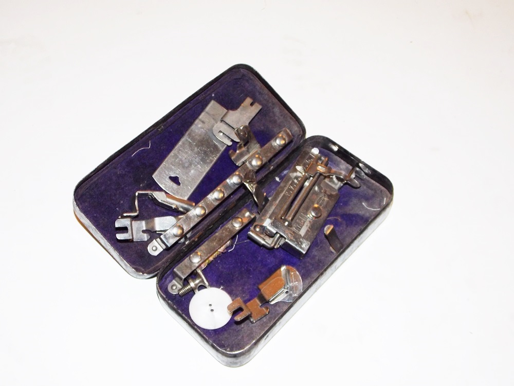 An Antique Minnesota Model B Treadle Sewing Machine in a Tiger oak