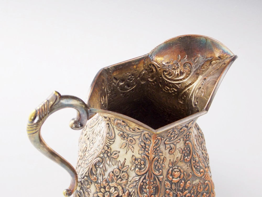 A Wonderful Antique Silver Over Copper Pitcher with Embossed Floral