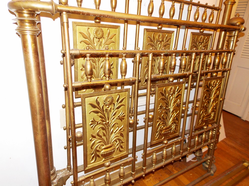 An Antique Brass Bed With Decorative Embossed Panels, Spindles and Finials EBTH