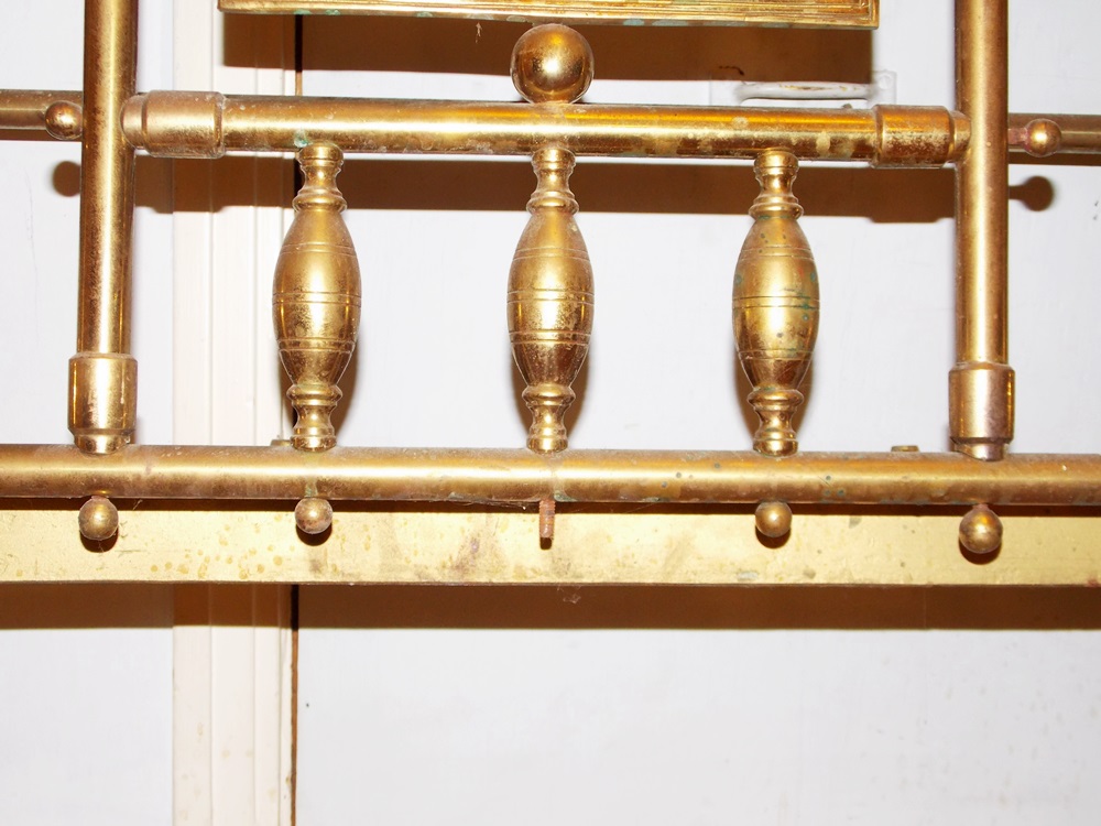 An Antique Brass Bed With Decorative Embossed Panels, Spindles and Finials EBTH