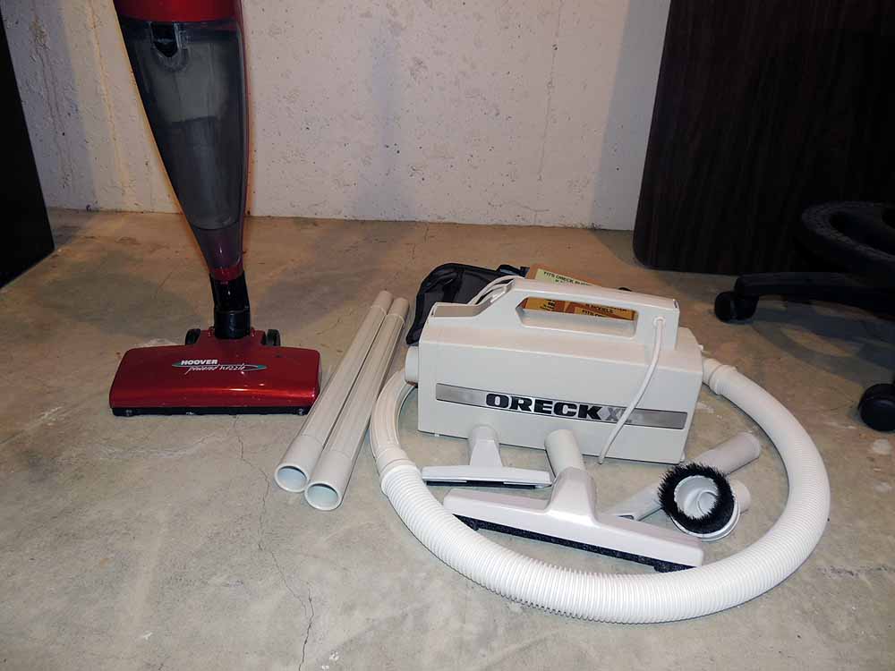 A Hoover "Flair" Bagless Stick Vacuum and OreckXL Portable Vacuum EBTH