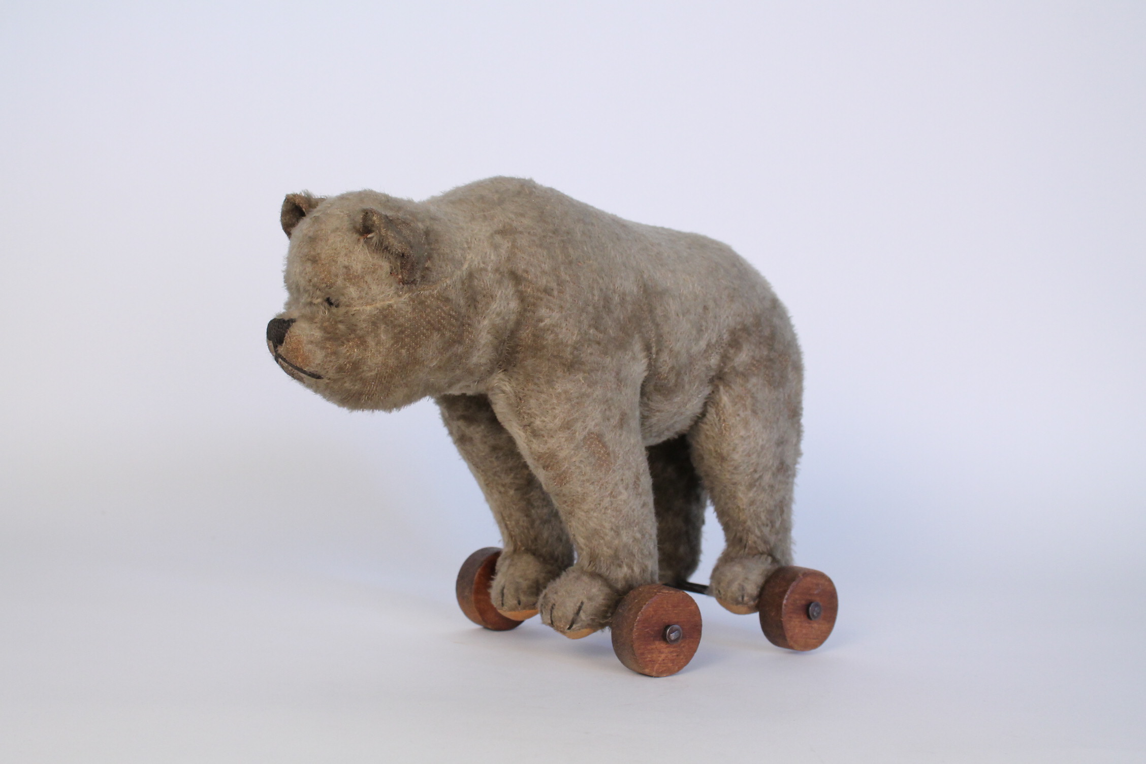 antique steiff bear on wheels