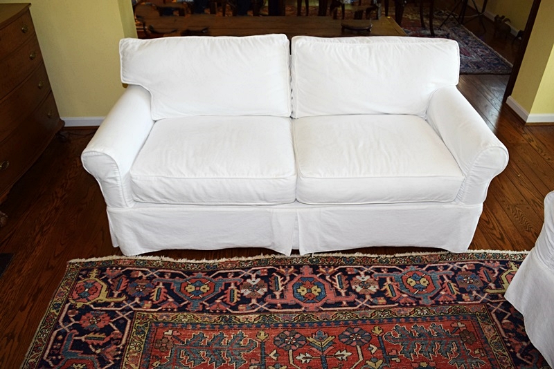 An Arhaus Two Cushion Sofa with White Canvas Slipcover EBTH