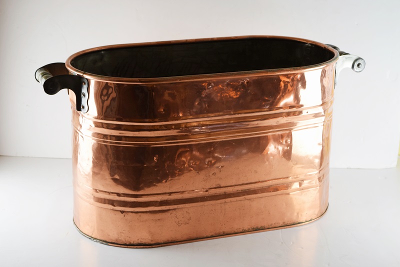 A Vintage Oval Copper Firewood Bucket with Wooden Handles EBTH