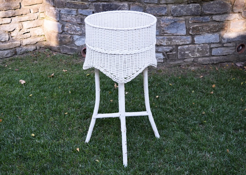 A Vintage White Wicker Plant Stand EBTH