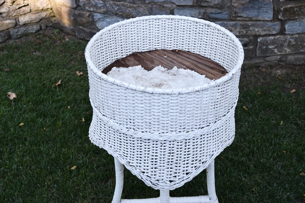 A Vintage White Wicker Plant Stand EBTH