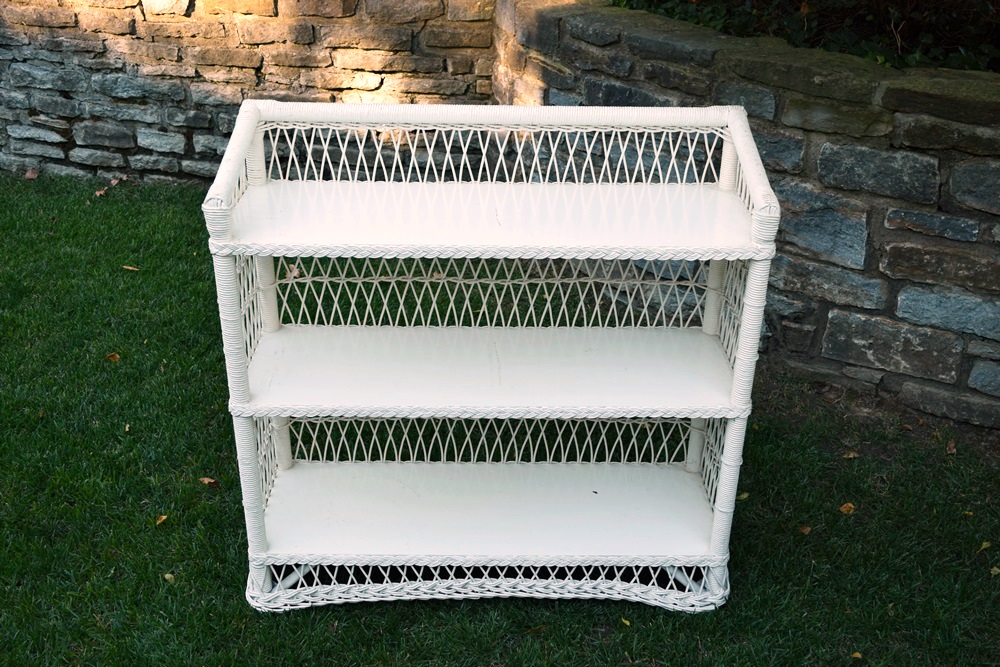 A Vintage White Wicker Bookcase EBTH