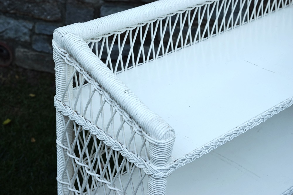 A Vintage White Wicker Bookcase EBTH