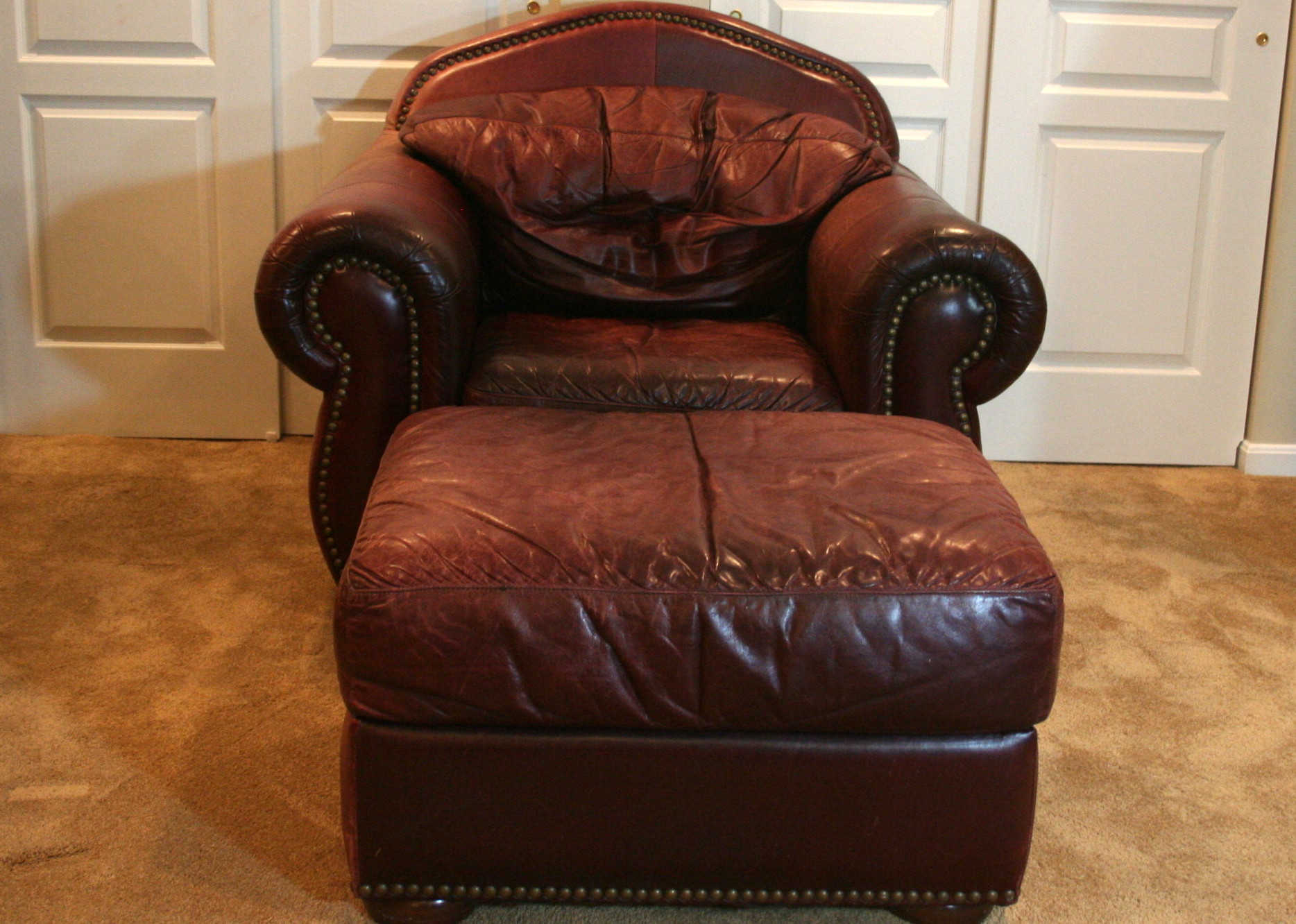 overstuffed leather chair and ottoman