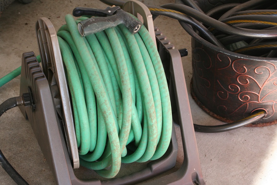 Reel With Garden Hose And Flower Pot Garden Hose Holder Ebth