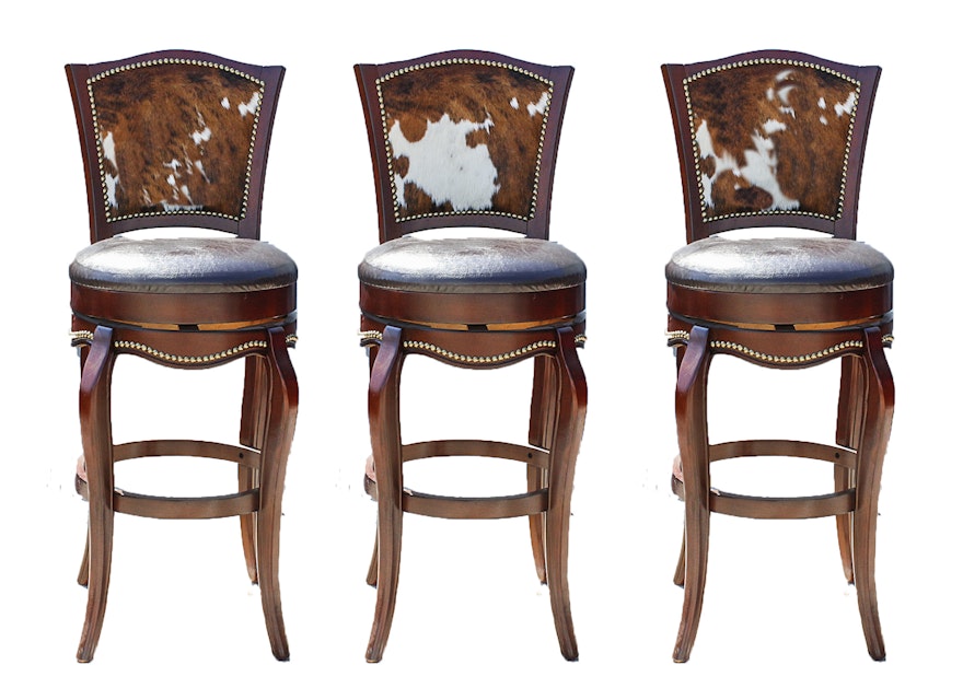 Three Leather And Cowhide Upholstered Barstools Ebth