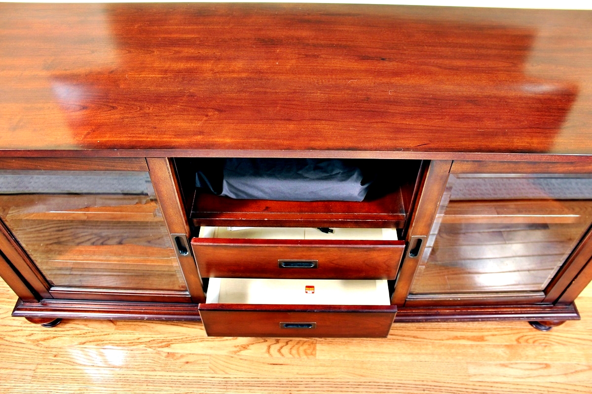 Traditional Style Oak Media Console with Sliding Doors. EBTH