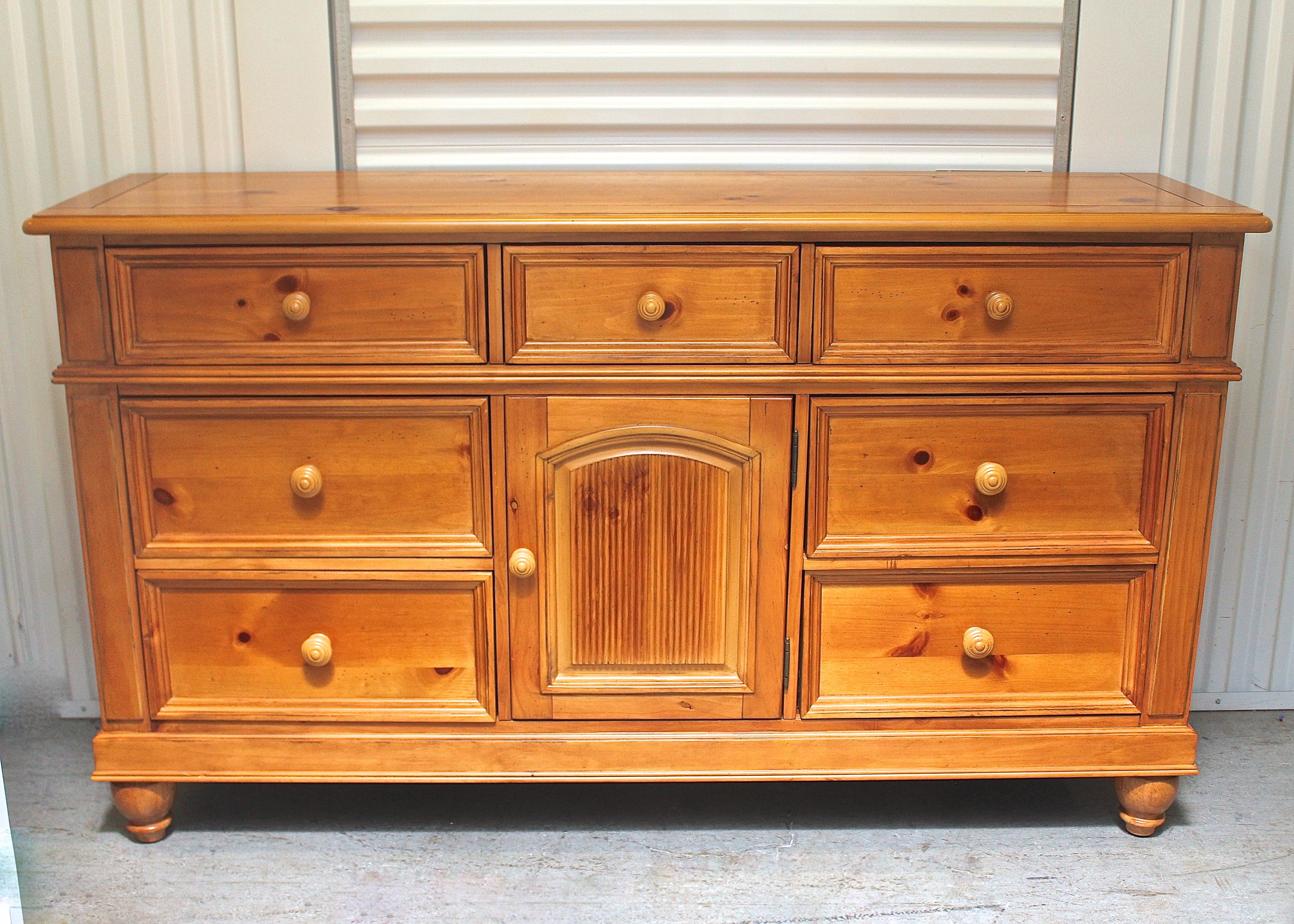 Broyhill Seven Drawer Dresser With A Center Cabinet Ebth