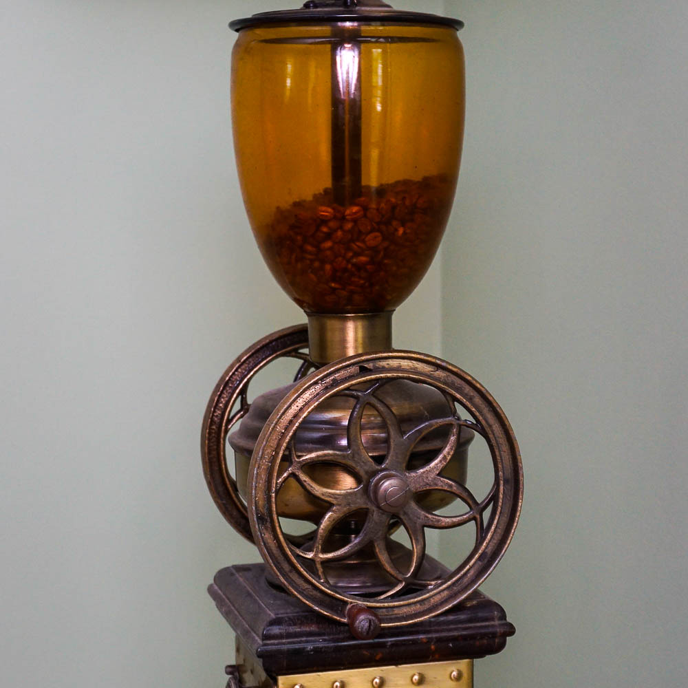 Antique Coffee Grinder and Amber Glass Lamp with Oak Stand EBTH