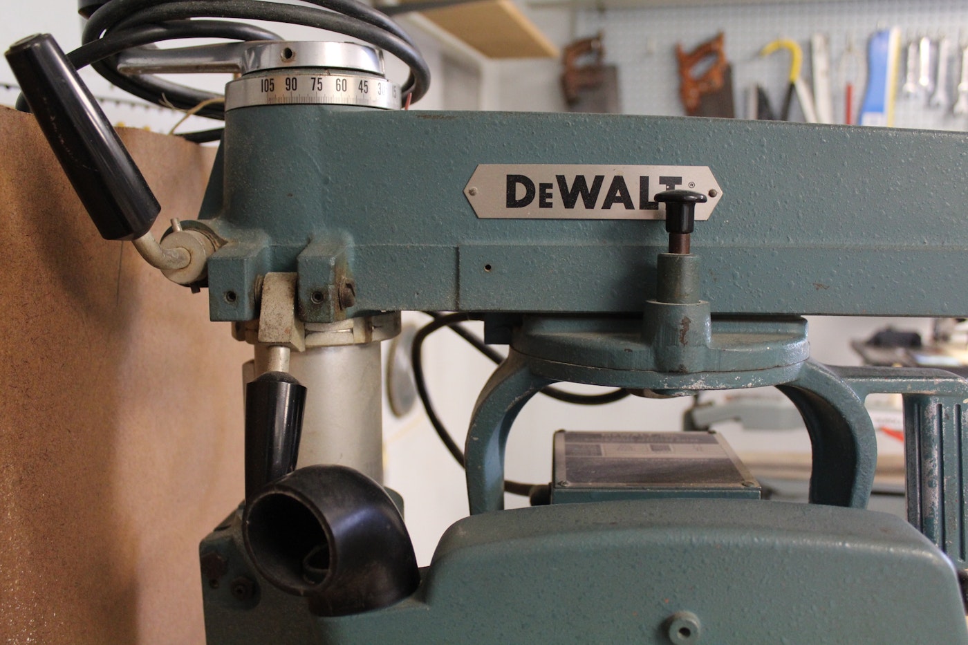 DeWalt Power Shop Radial Arm Saw on Stand and Wall of Blades EBTH