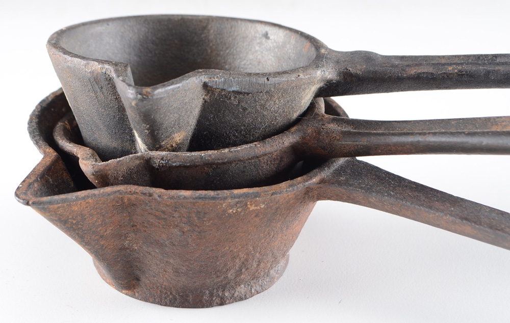 Collection of Cast Iron Clothing Irons and Measuring Cups EBTH