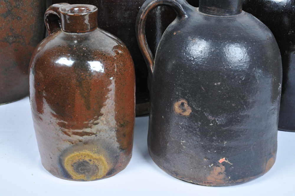 Assortment of Antique Stoneware Whiskey Jugs EBTH