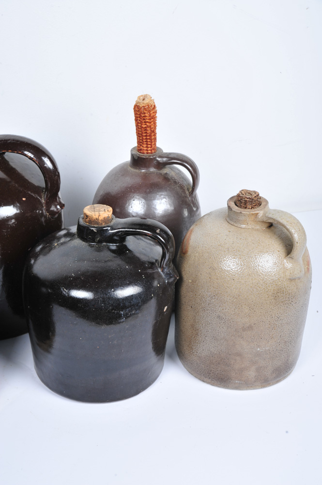Assortment of Antique Stoneware Whiskey Jugs EBTH