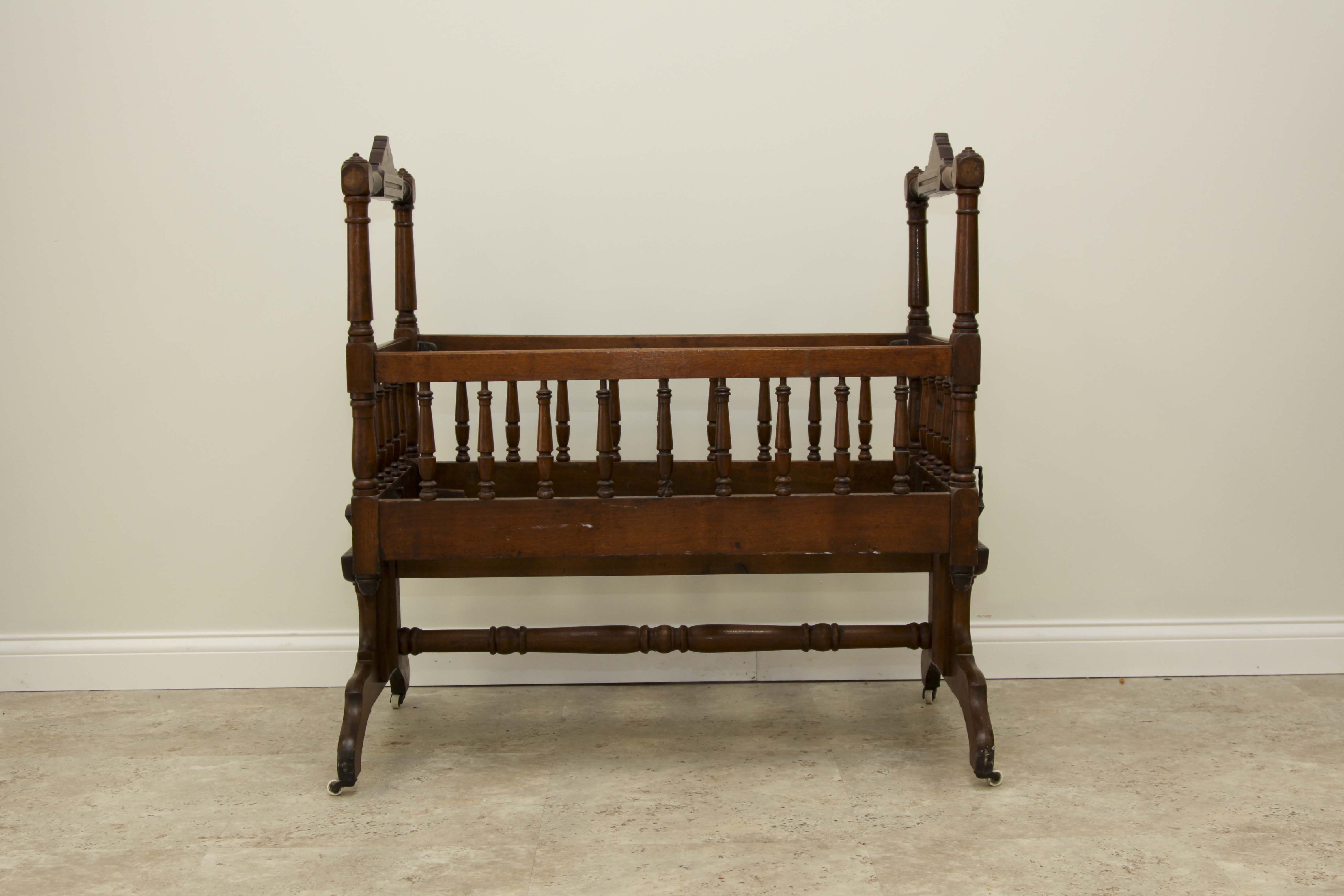 antique rocking cradle        
        <figure class=