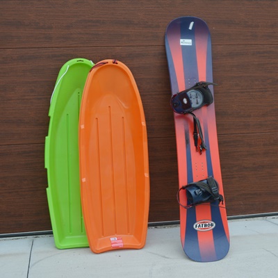 K2 Fat Bob Snow Board and Two Plastic Sleds EBTH
