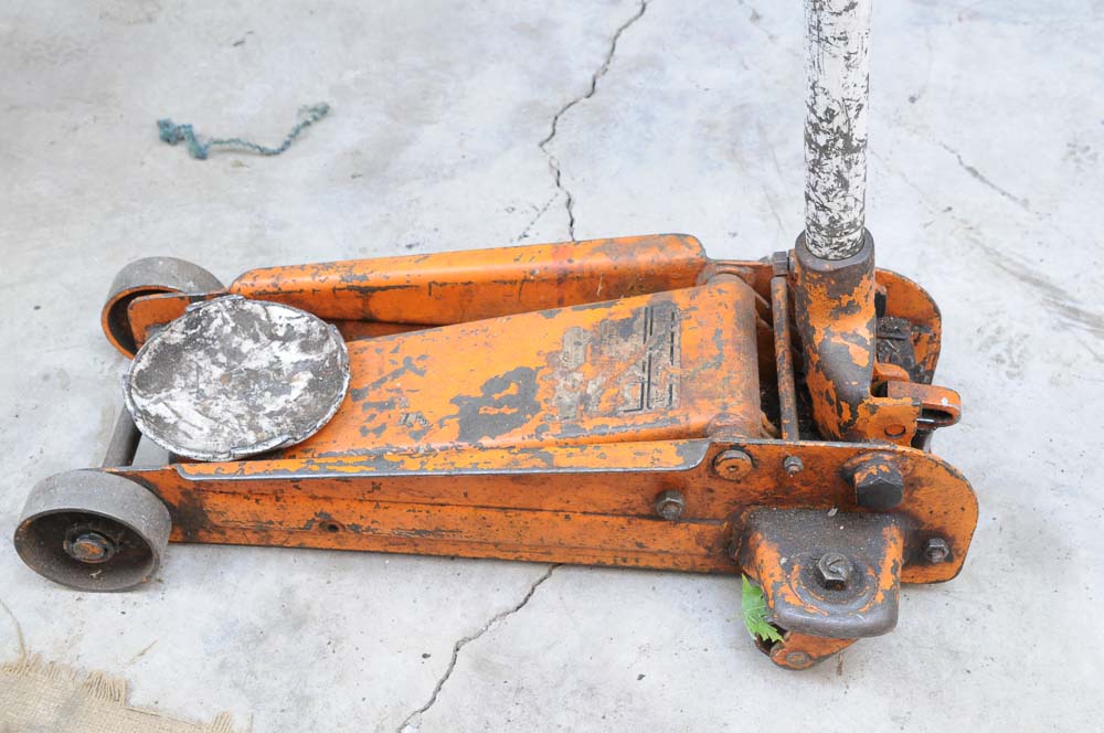 Two Hydraulic Floor Jacks and Blue Point Creeper EBTH