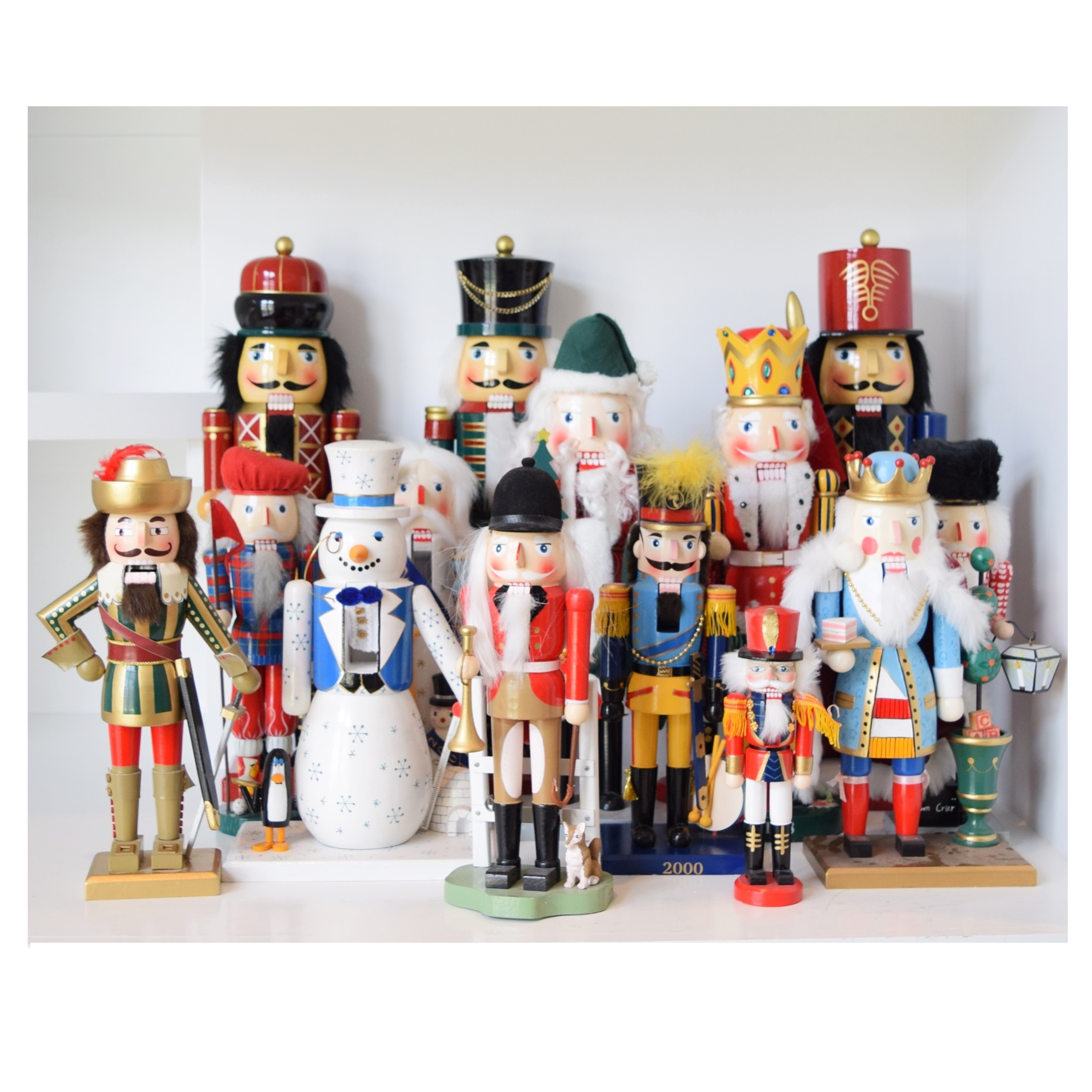 An Assortment of Sixteen Wooden Nutcrackers in Various Sizes EBTH