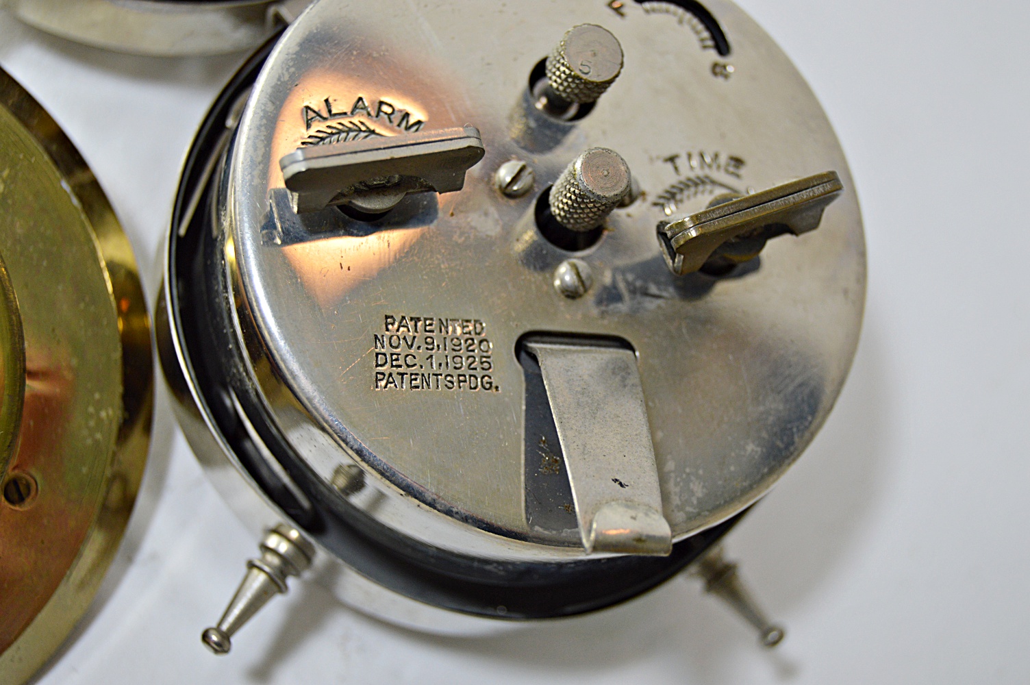 Four 1920s Alarm Clocks and Elgin Swivel Clock on Marble Base EBTH