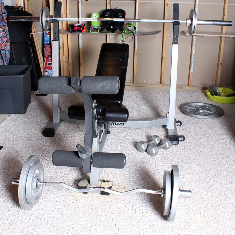 Nautilus Fold Up Olympic Weight Bench With Accessories Ebth
