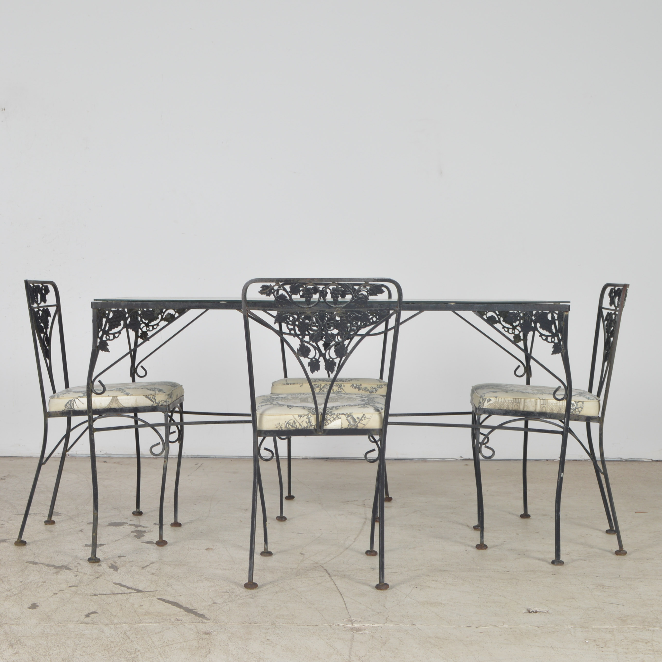 Wrought Iron Patio Table and Four Chairs | EBTH