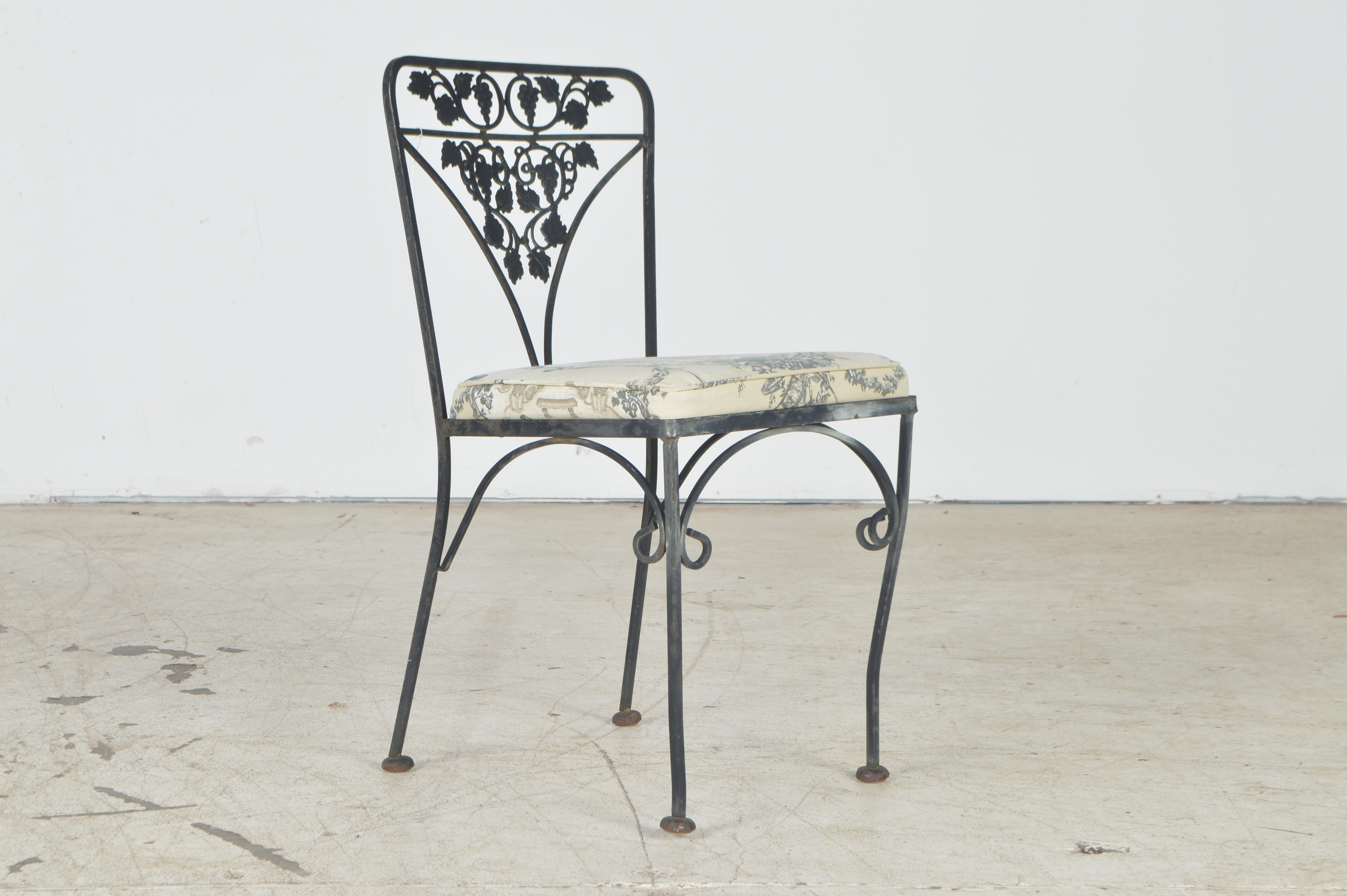 Wrought Iron Patio Table and Four Chairs | EBTH