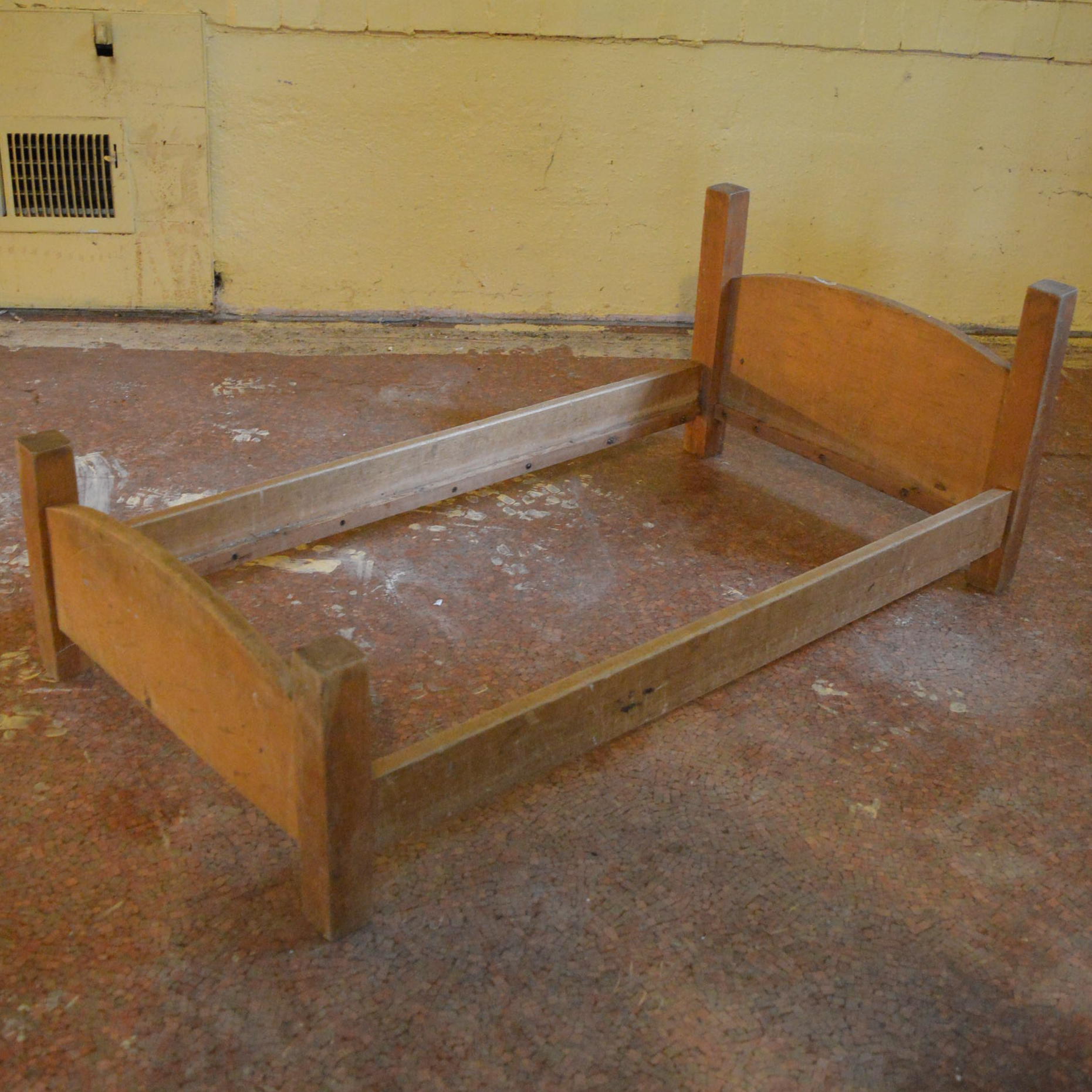 large wooden doll bed