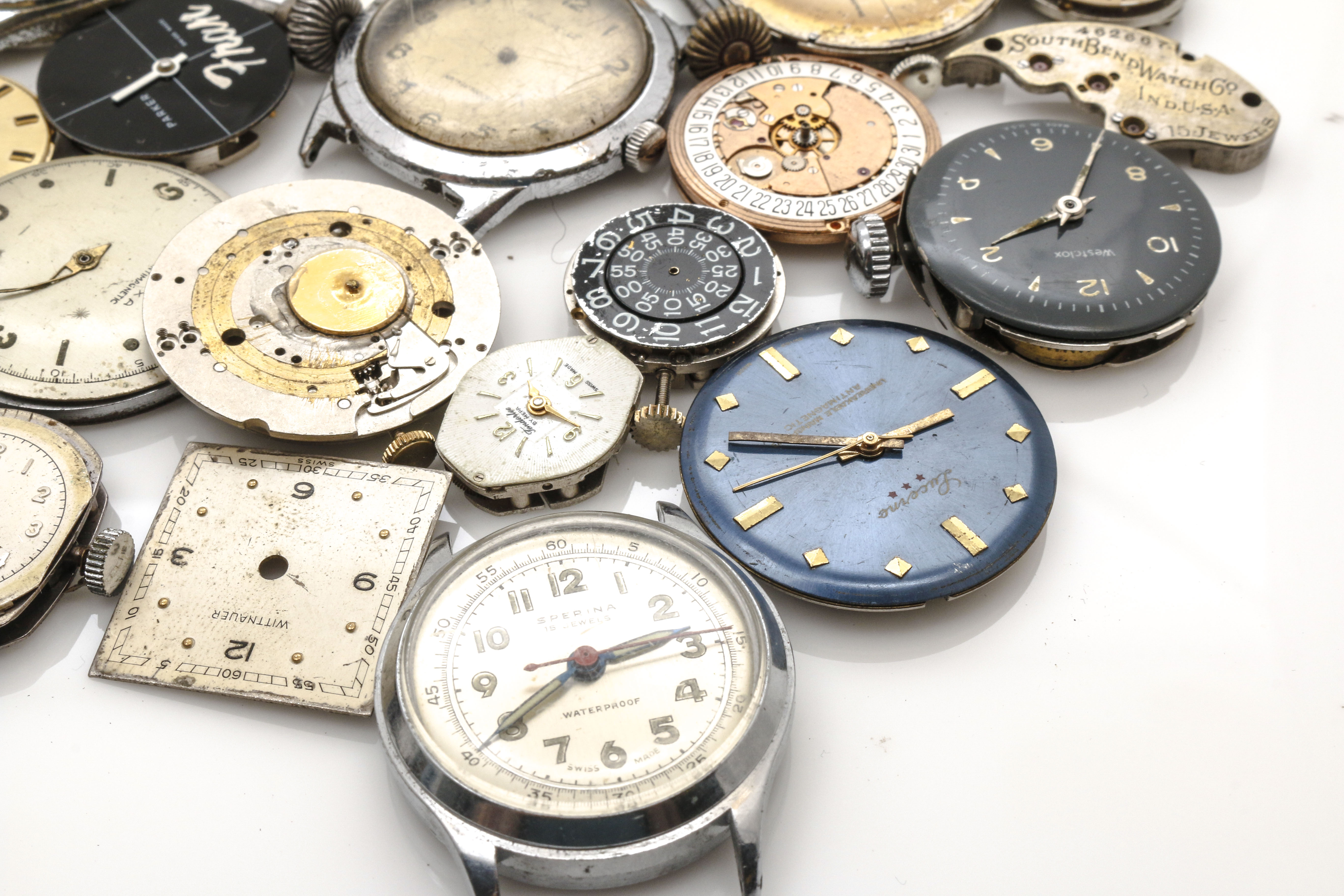 assortment-of-watch-movements-dials-cases-and-parts-ebth