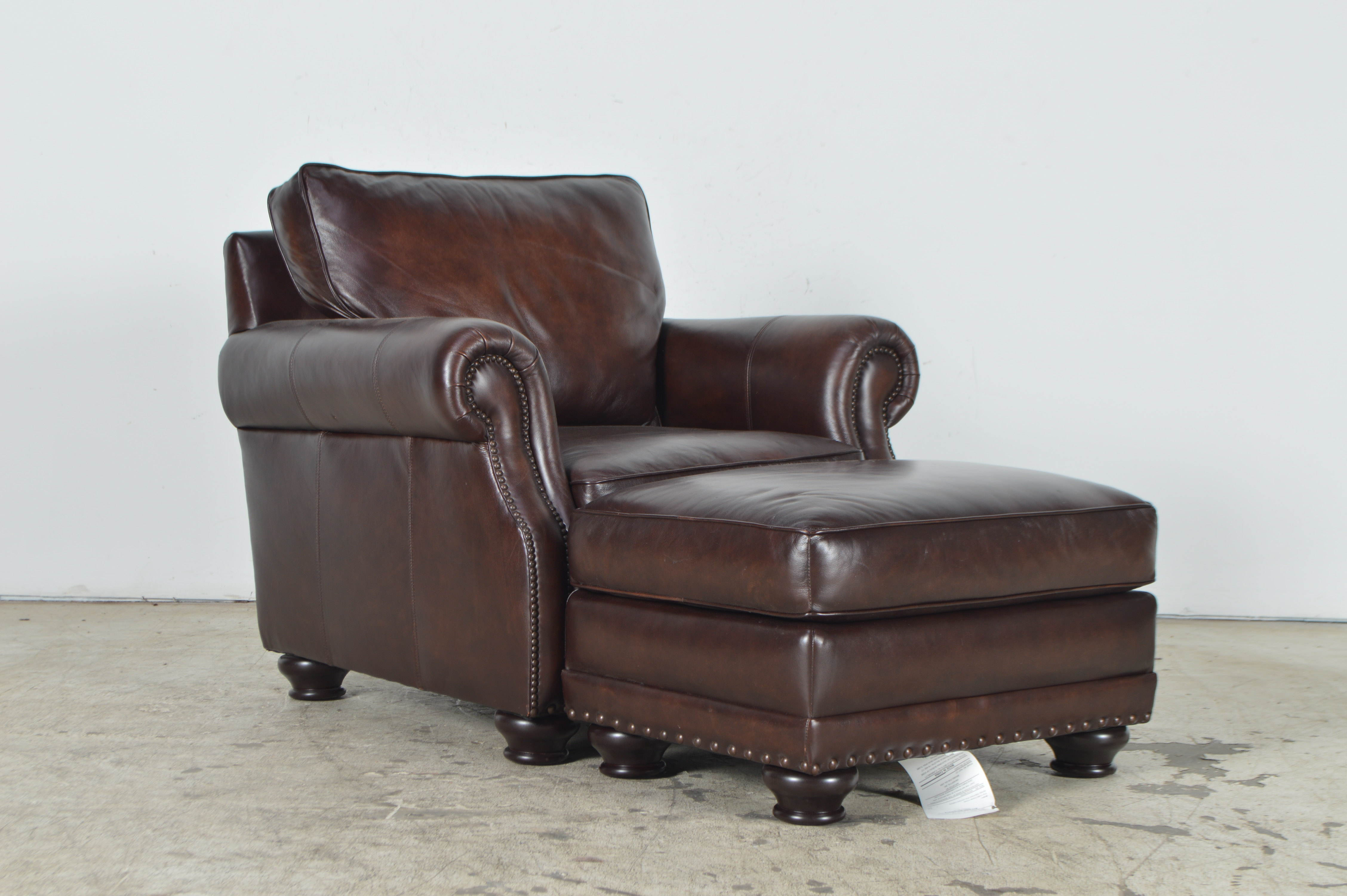 Havertys Furniture Brown Leather Armchair with Ottoman EBTH