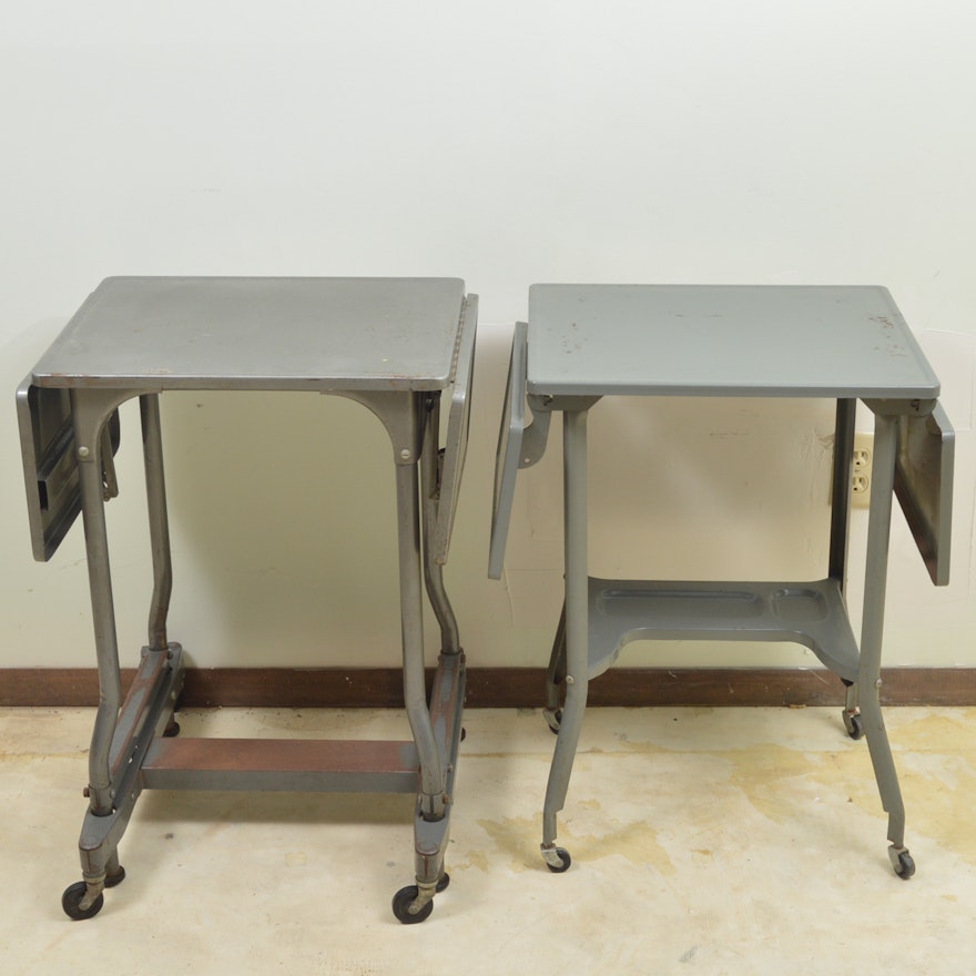 Two Gray Metal Drop Leaf Tables On Wheels Ebth Two Gray Metal Drop Leaf Tables On Wheels