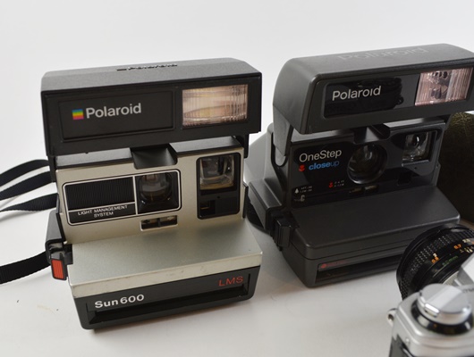Polaroid Instant Cameras, Canon SLR Camera, and Keystone
