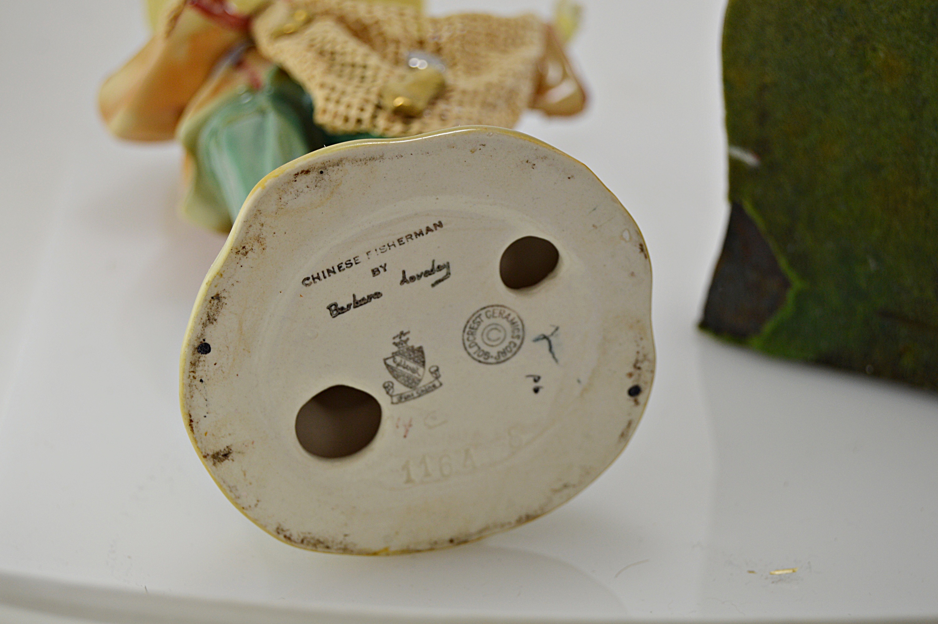 Vintage Porcelain Goldcrest Figurine and Cast Iron Bookend EBTH