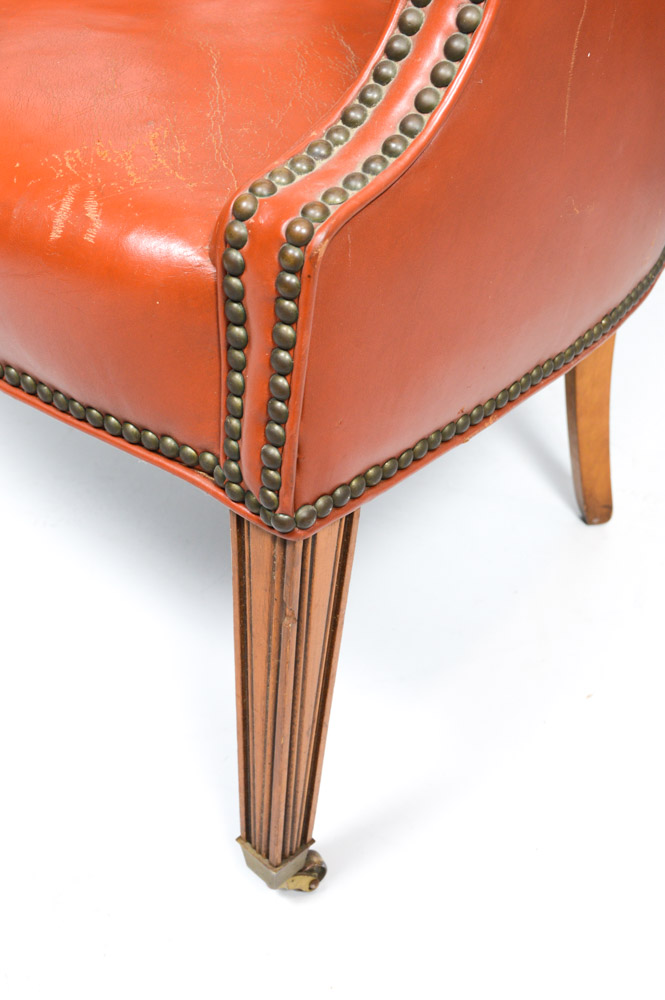 pair of rust leather armchairs