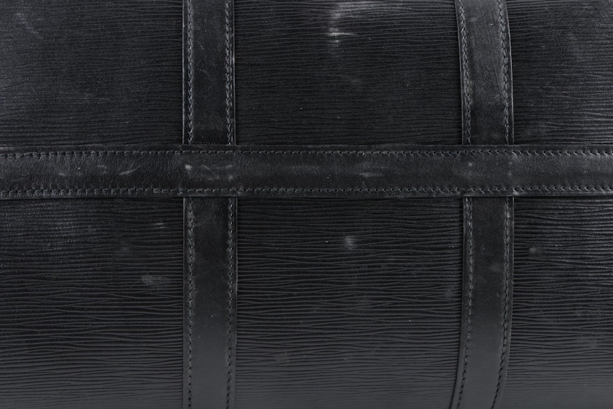 Lot - A Louis Vuitton monogram canvas suit carrier 60 with Vachetta leather  handle and trim, gold tone hardware