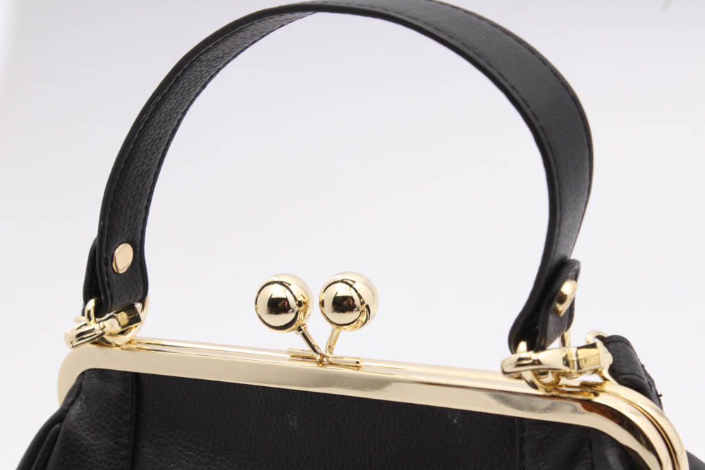 leather kiss lock handbag