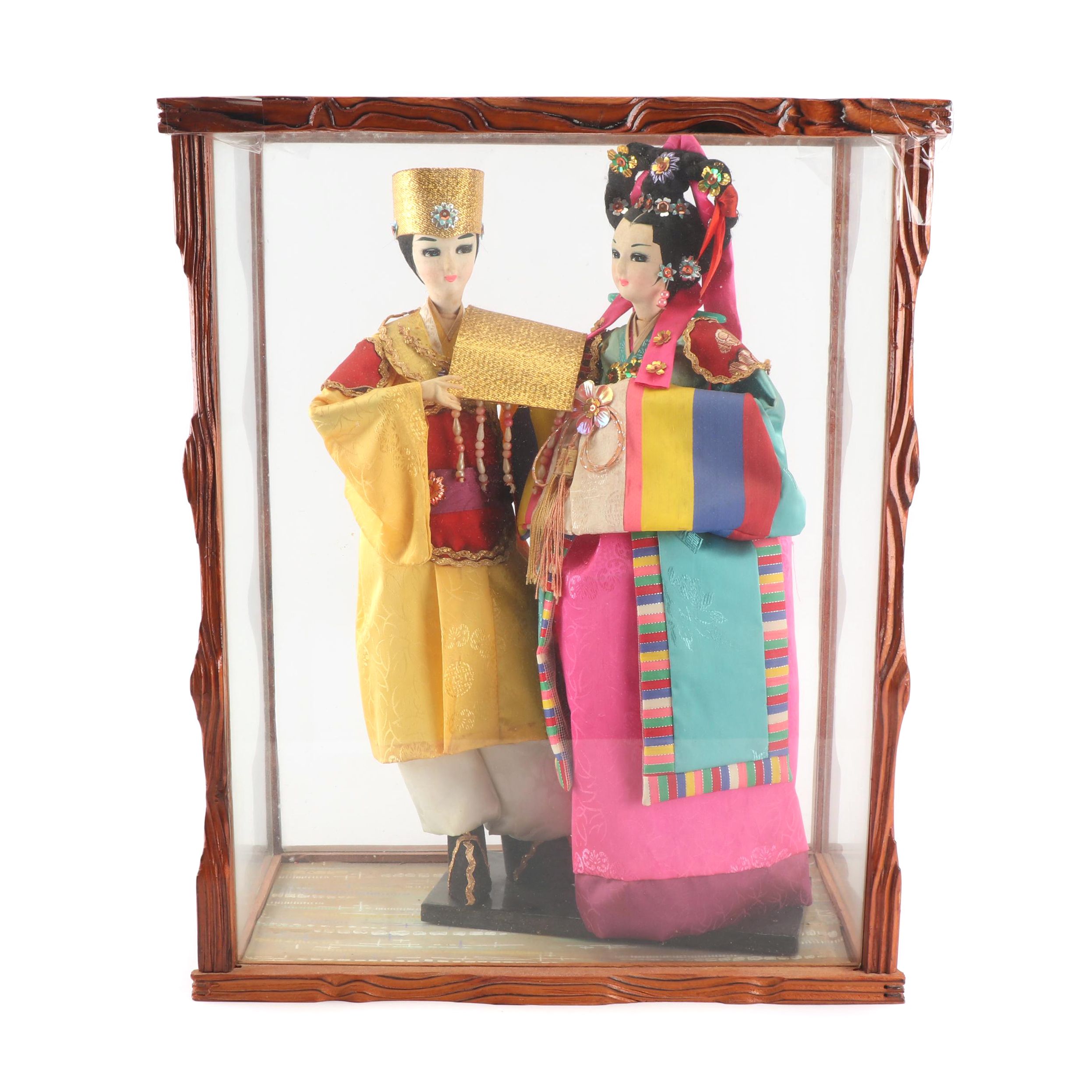 korean dolls in glass case