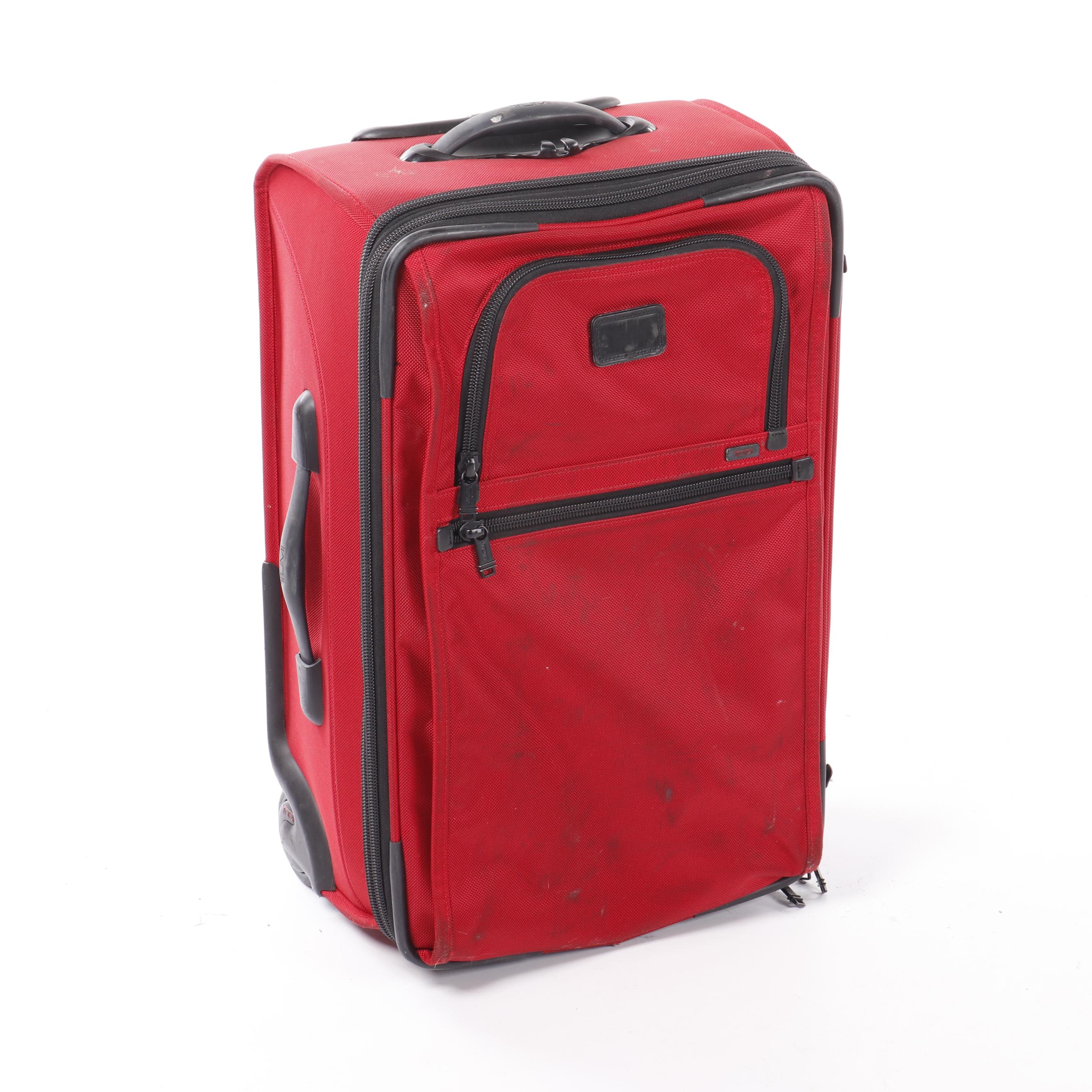 tumi red luggage