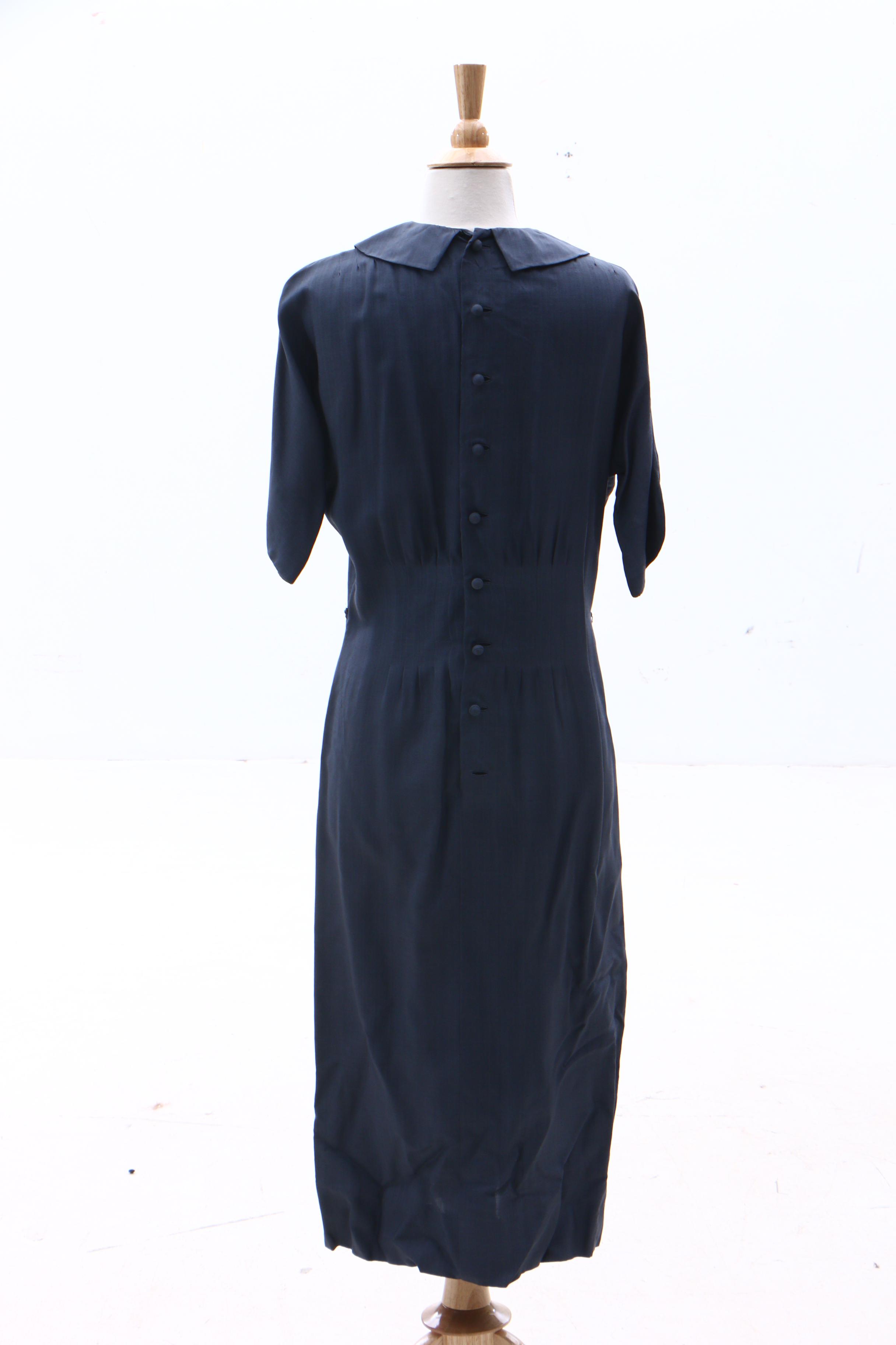 Bergdorf Goodman Black Silk Dress And Blue Uniform Style Dress 1950s   1554748592597 61ffbe58b500602e981df2498081608b76c5aa44b3e9b67c50faefe78fd213be.JPG