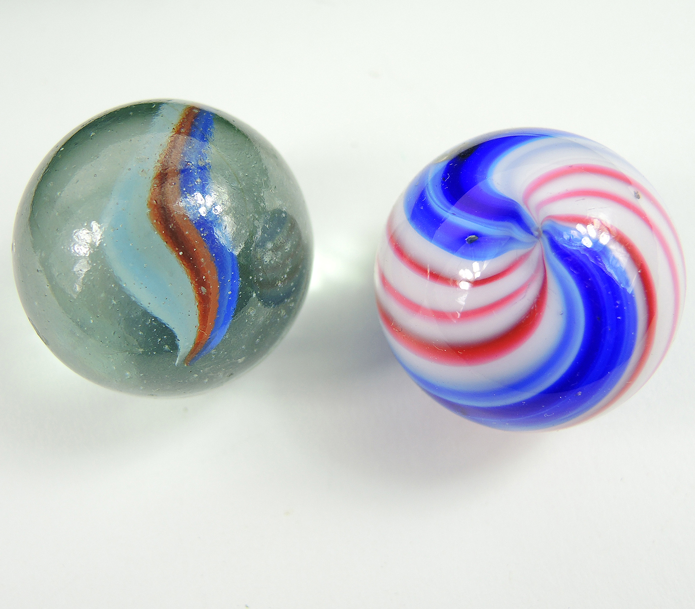 Glass and Clay Marbles with Corkscrews and Large Peppermint in Display