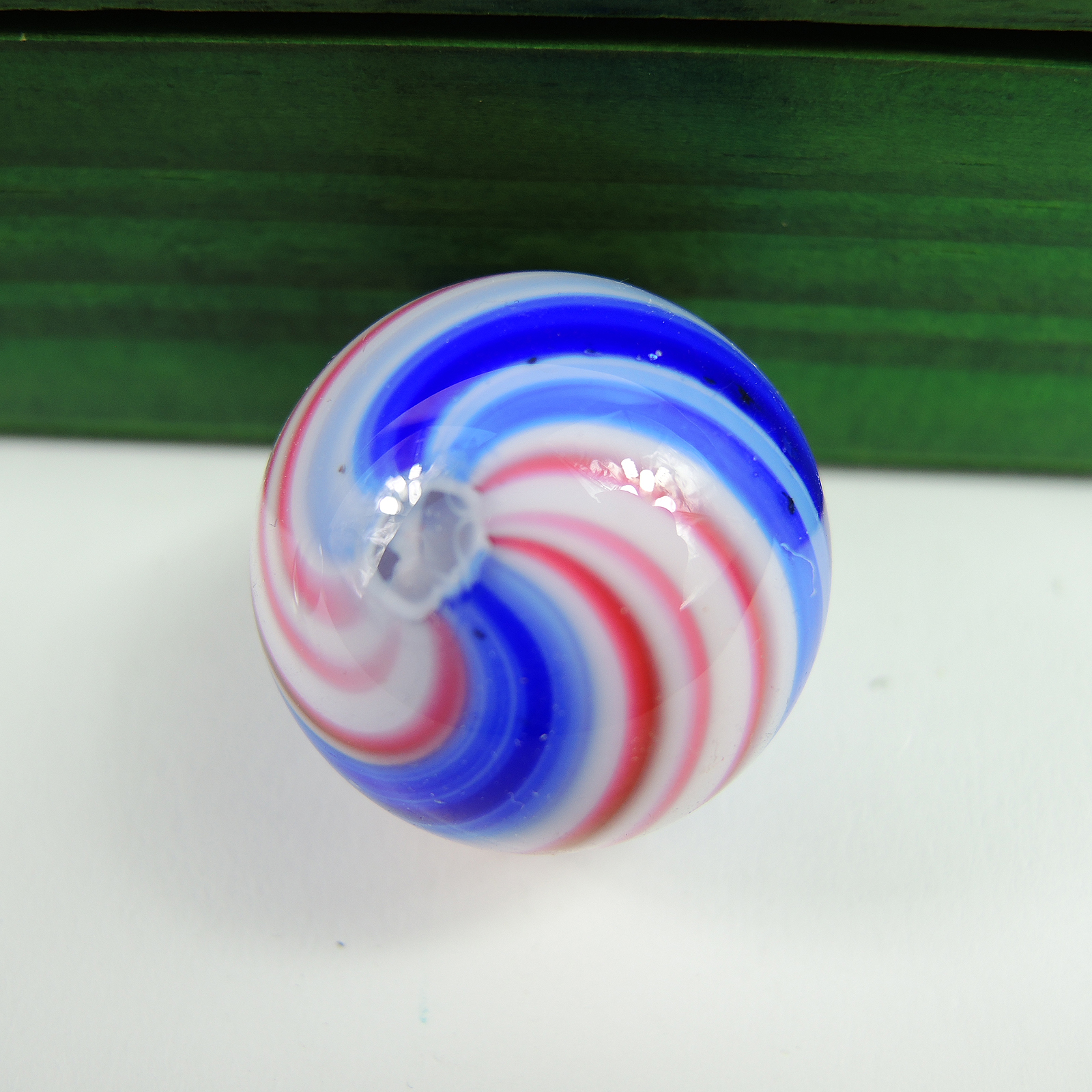 Glass and Clay Marbles with Corkscrews and Large Peppermint in Display