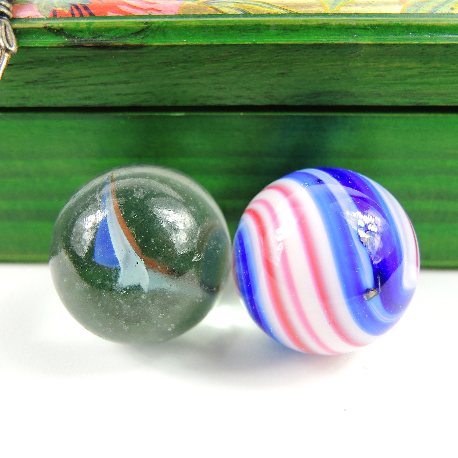 Glass and Clay Marbles with Corkscrews and Large Peppermint in Display